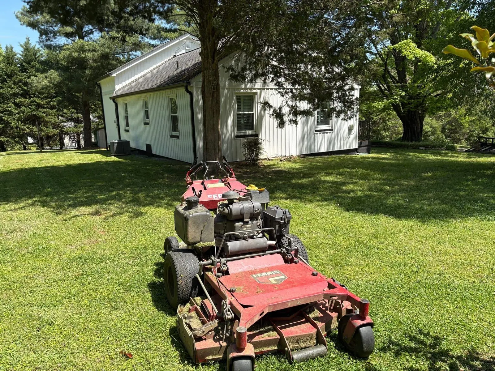 Walk-behind mower on a maintained Blount County lawn